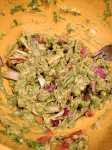 My guacamole with avocados, red onions, tomatoes, sea salt, pepper, lime juice and garlic powder